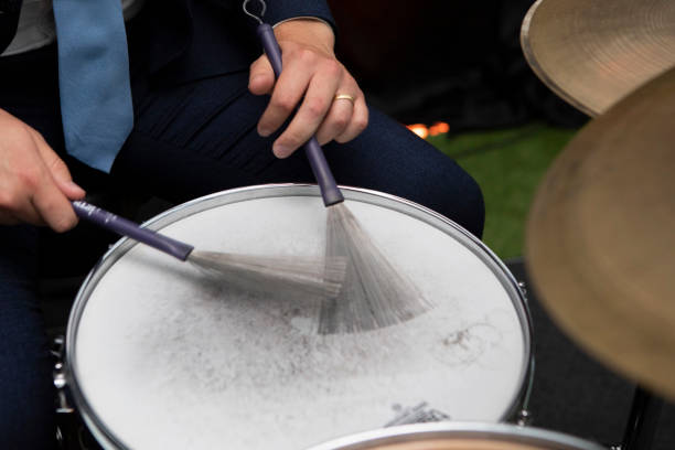 Dhak is a special drum or musical instrument played during durga puja festival. dhaks are kept together against red background.