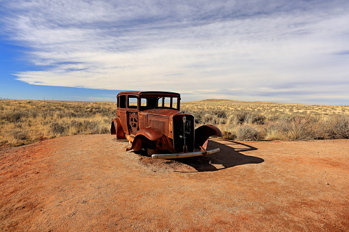 Route 66 abandoned car situated near the entrance of Petrified Forest National Park in Arizona, USA
