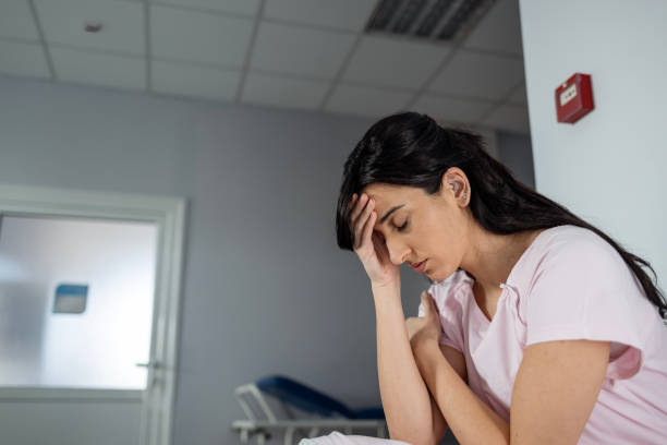 istock Woman with eyes closed while sitting in waiting room 1477405212