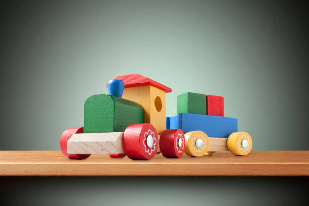 Wooden toy train on the shelf.