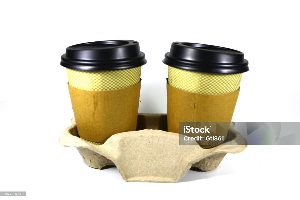 Disposable Coffee Cup Disposables coffee cup wih plastic black colored cap on it, shot on white background.  with cardboard. Black Color Stock Photo