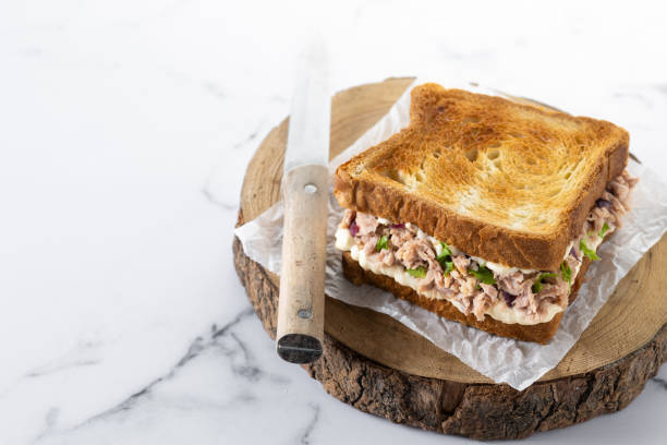 istock Tuna sandwich with vegetables on marble background 1477409469