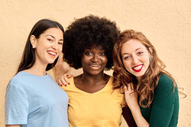 istock Portrait of three multiracial friends smiling at camera 1477411152