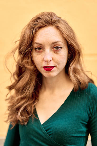 istock Caucasian woman with red lips looking at camera 1477411192