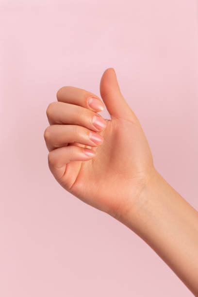 istock female hand with japanese manicure on pink background 1477411409