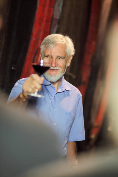 istock Senior farmer in a family wine cellar 1477418517