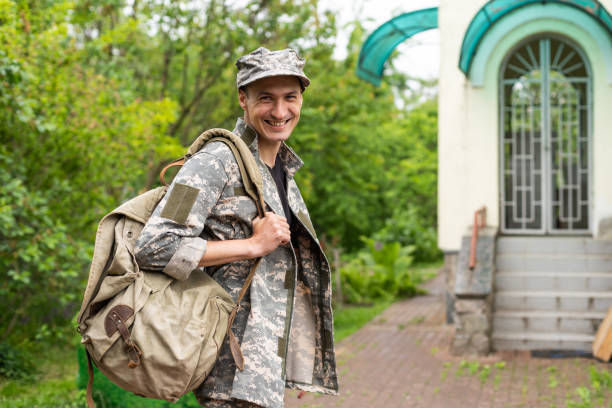 istock Young caucasian man wearing camouflage army uniform 1477422077