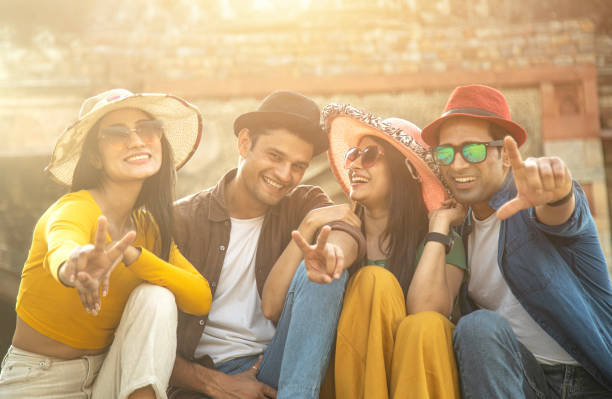 istock Group of friends having fun while posing together at historic site 1477424770