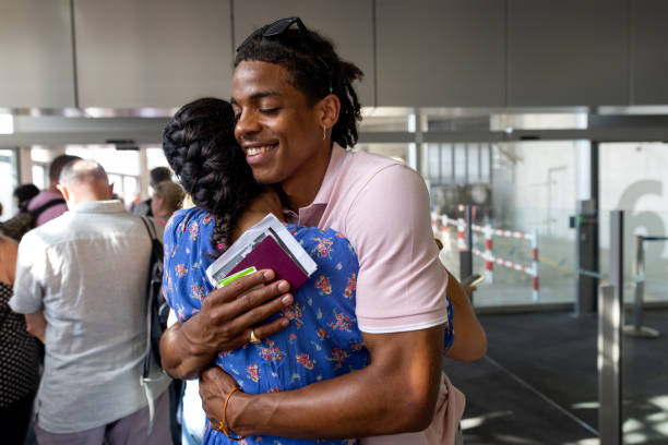 istock Embracing in Airport 1477429649