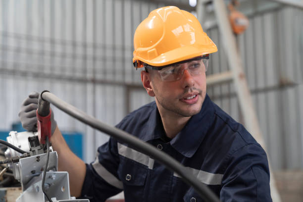 istock Male engineer worker working at work with automatic welding robotic arm machine in factory. Male technician worker checking, repair automatic welding robot arm machine at production line 1477429775