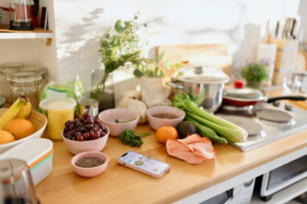Nutrition app on the kitchen countertop and fresh produce