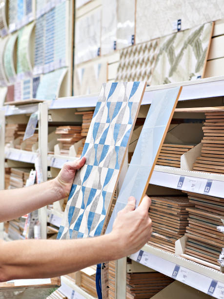 istock Man buying ceramic wall tiles in store 1477433314