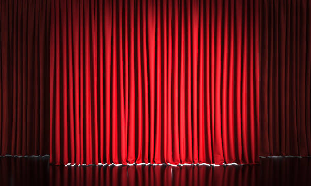 istock red velvet curtains and reflective black floor. 1477439685