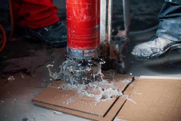 Drilling a hole into a concrete floor with core driller