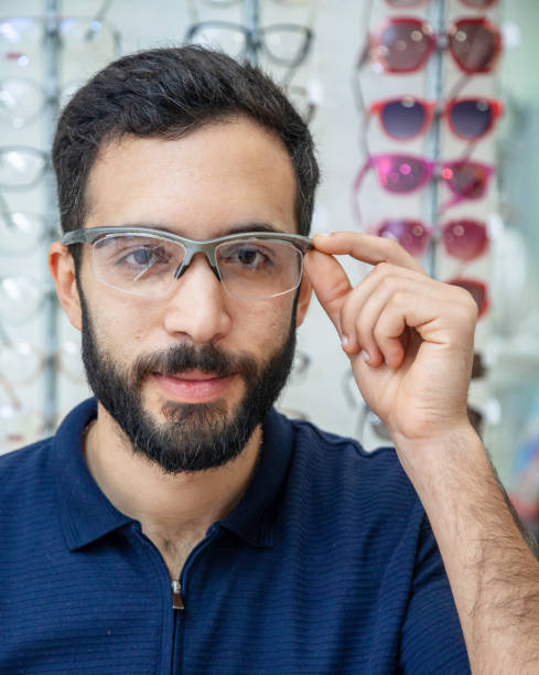 istock Men trying glasses in an optician 1477450859