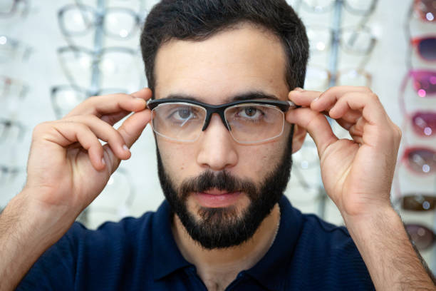 istock Men trying glasses in an optician 1477450860