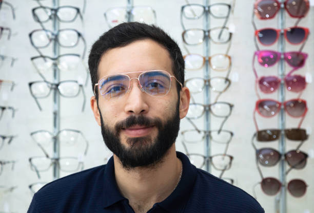 istock Men trying glasses in an optician 1477450882
