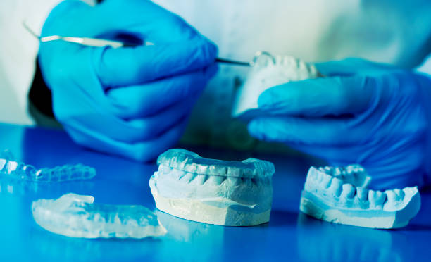 istock dentist adjusting an occlusal splint 1477453591