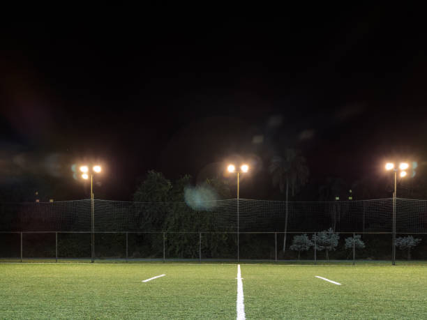istock Soccer field with illumination and night sky 1477455864