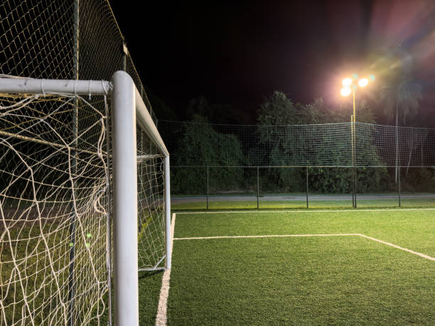 istock Soccer field with illumination and night sky 1477455868