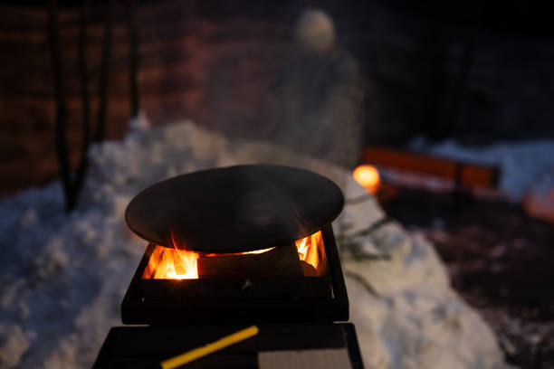 istock Wood fired barbecue with brgiht burning flame at evening time. 1477457805