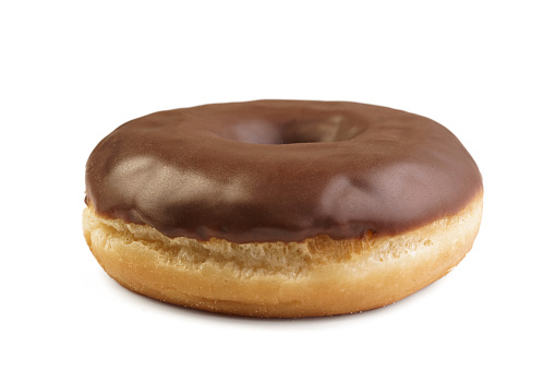 Chocolate donut on a white background. It lay flat. View from above