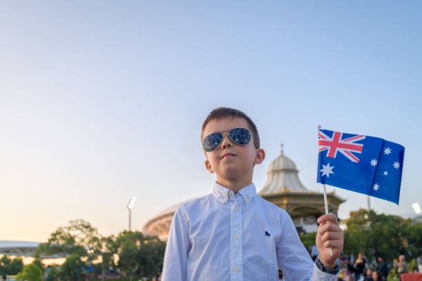 istock Australian kid holding a flag while celebrating Australia day 1477461558