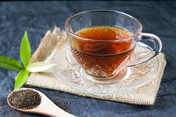 istock cup of hot sweet tea, over black background 1477464020