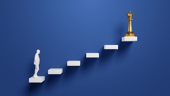 Ladder of success creative conceptual image. White figure of a businessman climbing the abstract staircase to golden king chess piece