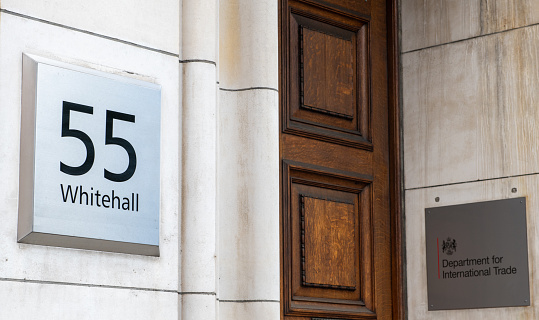The name signs and entrance to the United Kingdom government Department for International Trade.