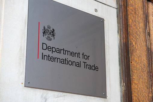 The name plate by the entrance of offices for the United Kingdom government Department for International Trade.