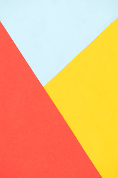 istock Abstract vertical background of red, blue and yellow triangles 1477469177