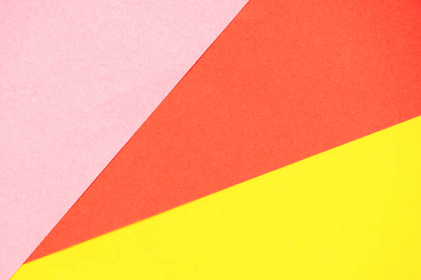 istock Red, pink and yellow paper background 1477469274