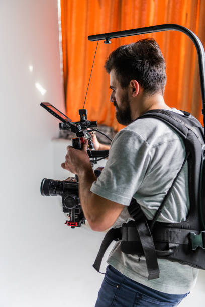 istock The cameraman in the studio using a professional camera with a stabilizer 1477469620