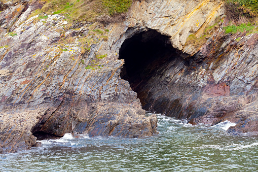 North coastline of Spain in Viavélez,Asturias, Spain. Breaking waves, caves,sea,coastline cliff.