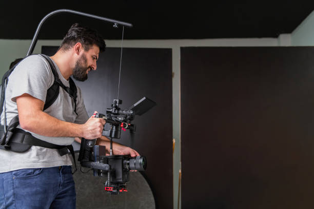 istock The cameraman in the studio using a professional camera with a stabilizer 1477469742