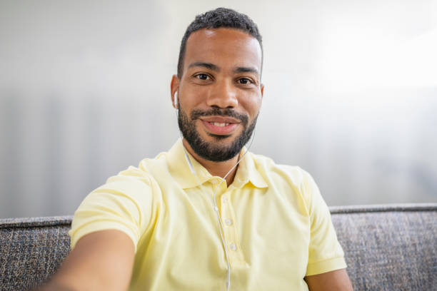 istock Man wearing headphones 1477470647