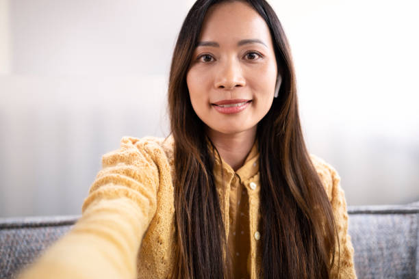 istock Woman wearing wireless headphones 1477470667