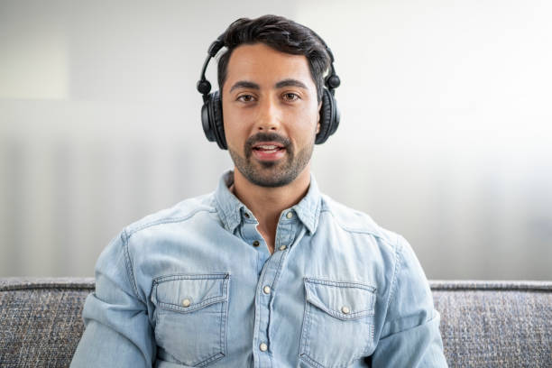 istock Man wearing headphones 1477470672