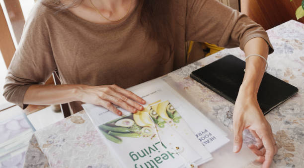 istock Nutritionist preparing information for a consultation at a client's home 1477471703
