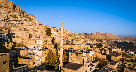 Mardin is a historic city in Southeastern Anatolia, Turkey. The city is known for its fascinating architecture and location: heavily decorated stone buildings cascading down a mountain, watching the vast expanse of the Mesopotamian plains below.\n\nIt is known for the Artuqid architecture of its old city, and for its strategic location on a rocky hill near the Tigris River.The old town of the city is under the protection of UNESCO, which forbids new constructions to preserve its façade.