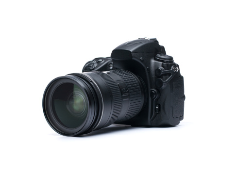 Professional DSLR Camera lense on black background.