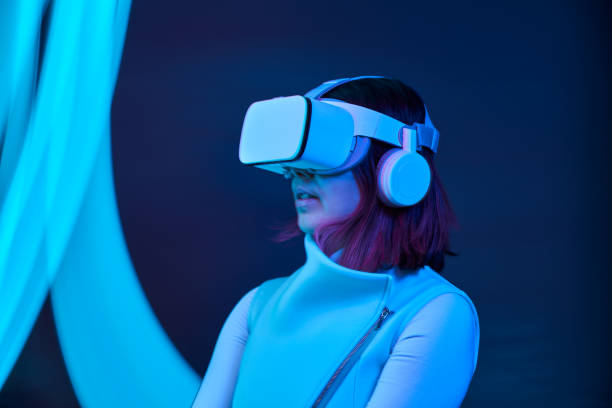 istock Woman is using virtual reality headset to access in metaverse. 1477474623