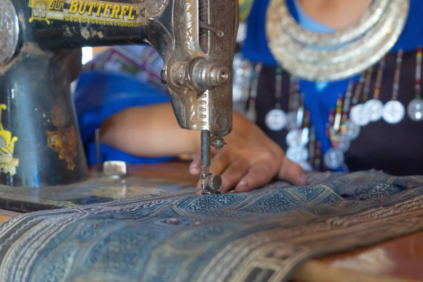 istock Local people hands using traditional manual weaving wool handloom textile cloth fabric machine yarn thread, local handmade craft material pattern and manufacturing technique design. People lifestyle. 1477475587