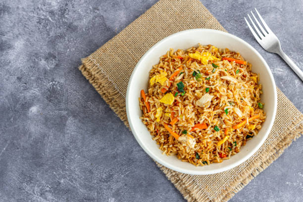 istock Fried Rice in a Bowl with Fork Directly Above Photo 1477478355