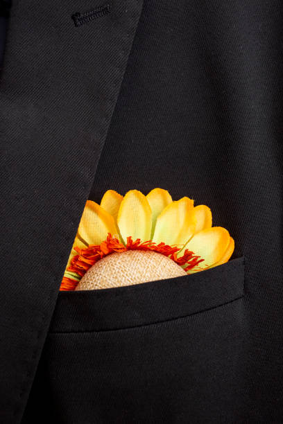 istock sunflower in a dark suit pocket 1477480192