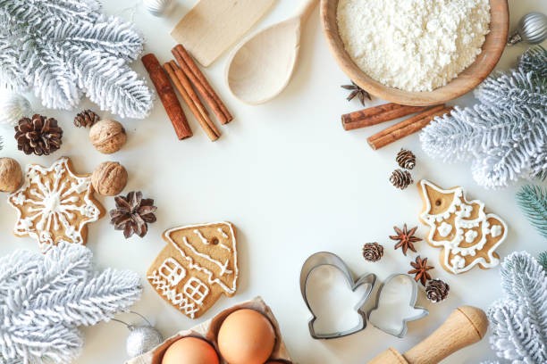 istock Bakery background with ingredients for cooking Christmas baking. Flour, eggs, cinnamon and gingerbread on the table top view 1477480319