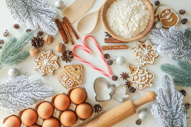 istock Bakery background with ingredients for cooking Christmas baking. Flour, eggs, cinnamon and gingerbread on the table top view 1477480320
