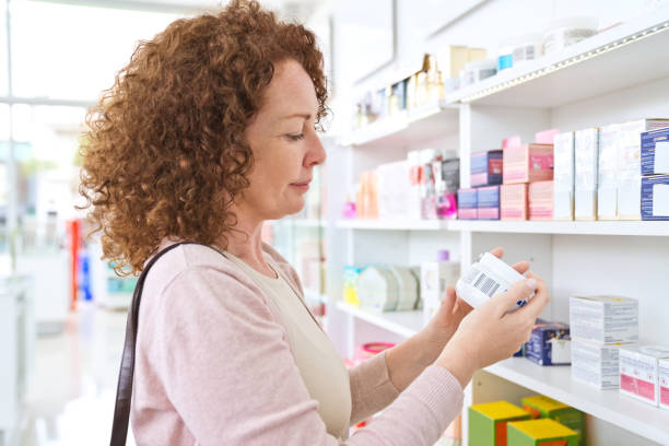 istock Mature woman doing shopping in pharamcy 1477480411