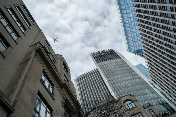 istock View to London skyscrapers and plane from below 1477482302